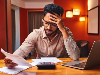 Man struggles to pay bills awaiting a settlement